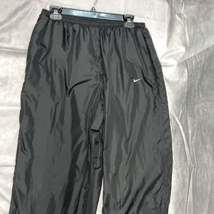 Large black nike sweat pants/joggers, bottoms of pants can unzip